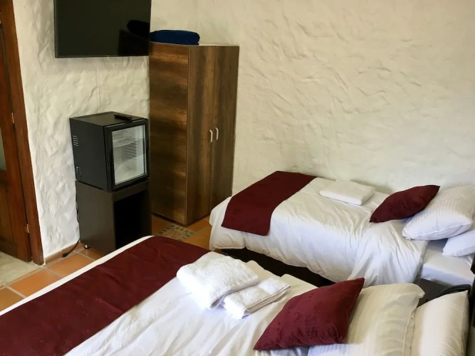 Standard Quadruple room with garden view