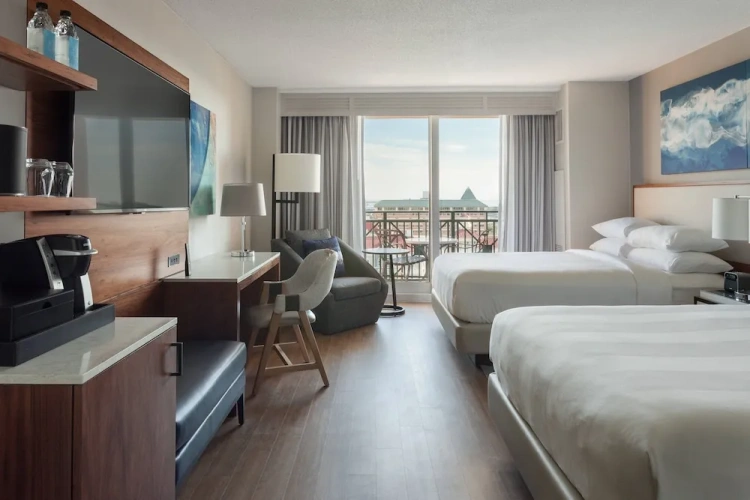Deluxe Quadruple room with balcony and with water view