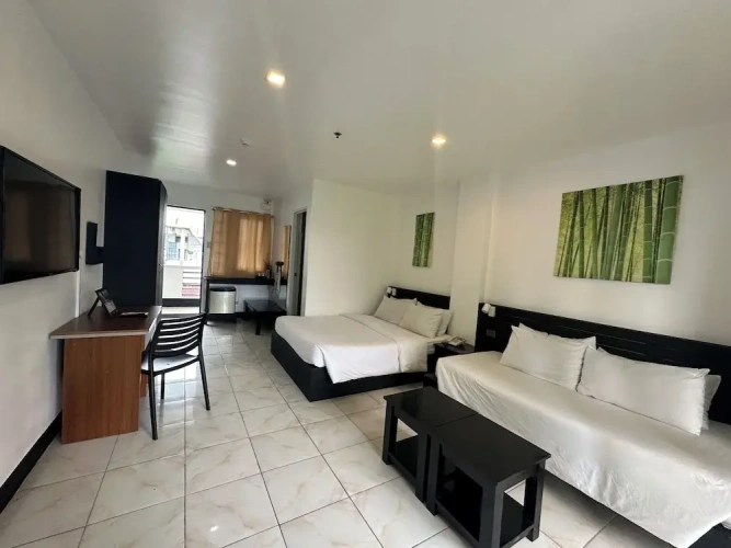 Standard Triple room with balcony and with garden view