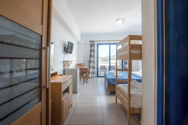 Standard Quadruple Family room with balcony and with garden view