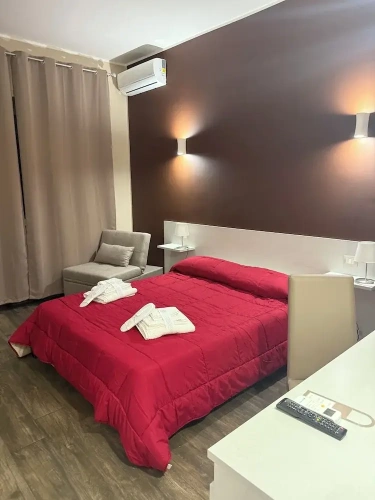 Standard Quadruple room with balcony and with partial sea view