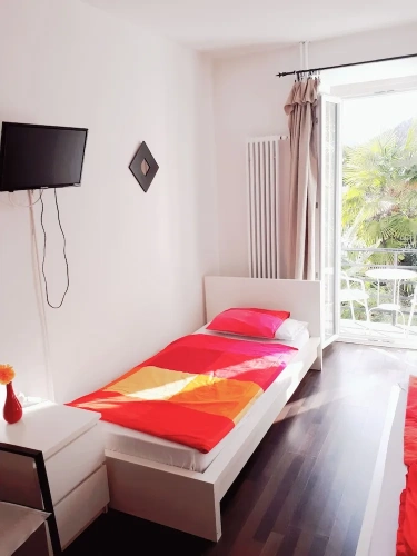 Standard Triple room with balcony and with garden view