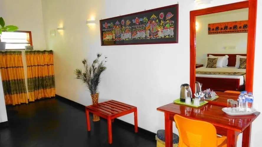 Deluxe Triple room with balcony and with garden view