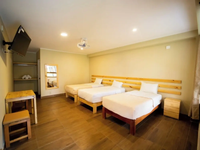 Standard Triple room with balcony and with garden view