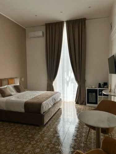 Superior Quadruple room with balcony and with city view