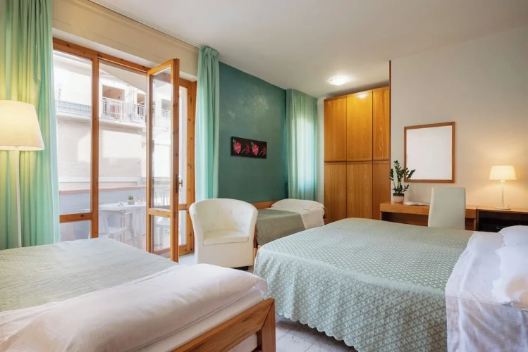 Standard Quadruple Family room with balcony and with garden view