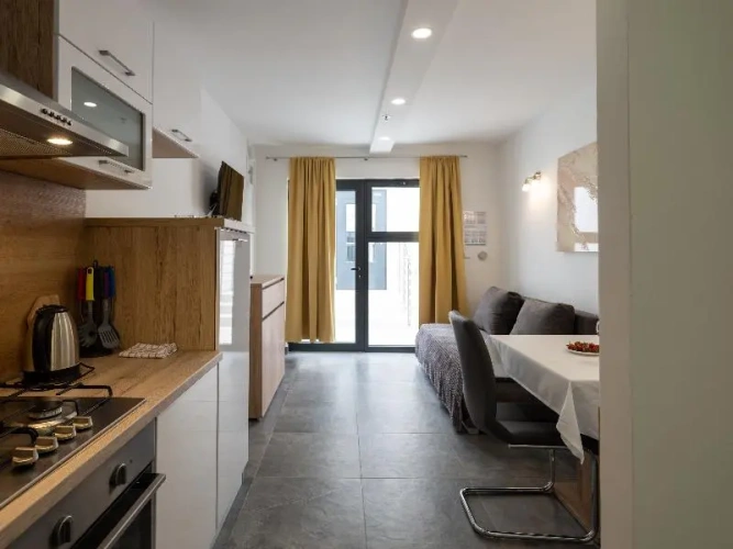 Apartment with balcony and with garden view