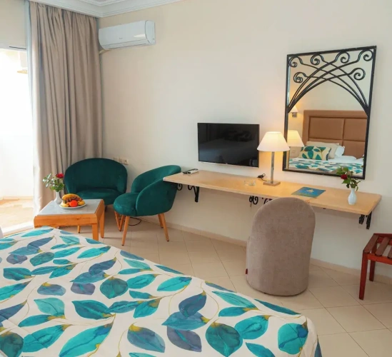 Standard Triple room with balcony and with garden view