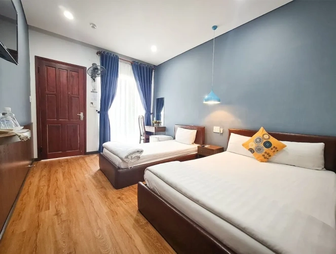 Standard Triple room with balcony and with garden view