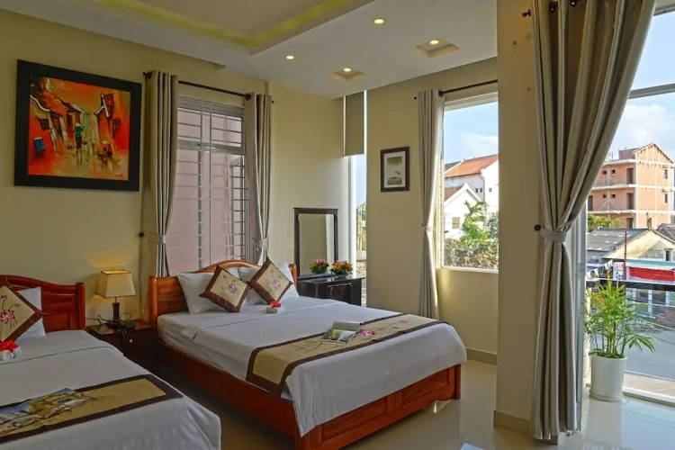 Deluxe Triple room with balcony and with garden view