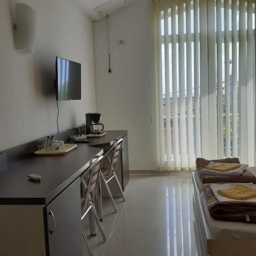 Standard Triple room with garden view