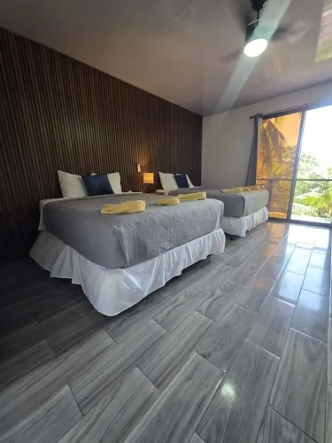 Standard Quadruple room with balcony and with partial ocean view