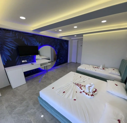 Deluxe Quadruple room with balcony and with sea view
