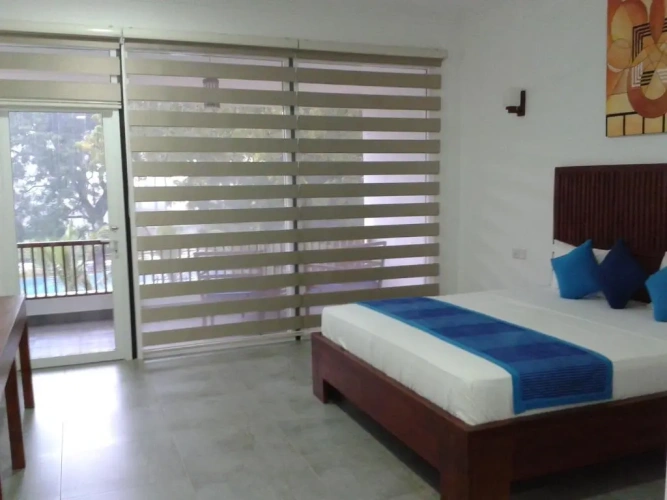 Standard Triple room with garden view