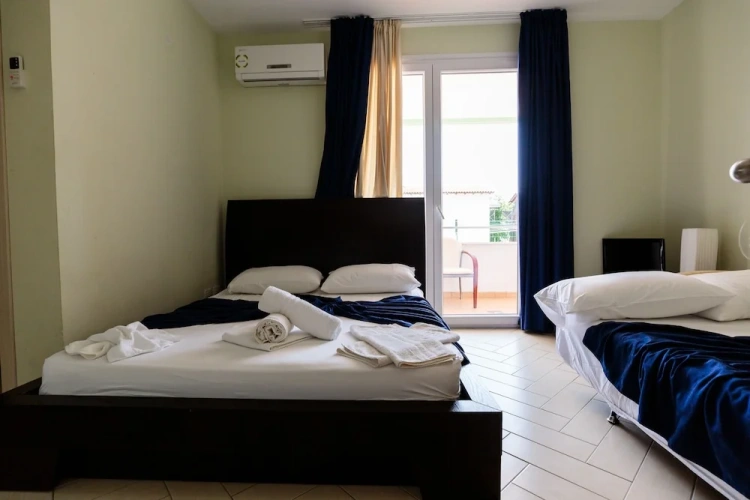 Standard Quadruple Family room with balcony and with partial sea view