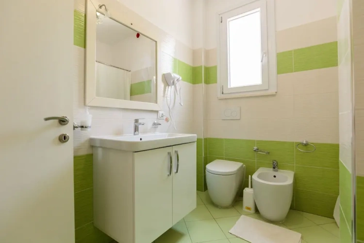 Standard Quadruple room with balcony and with partial sea view