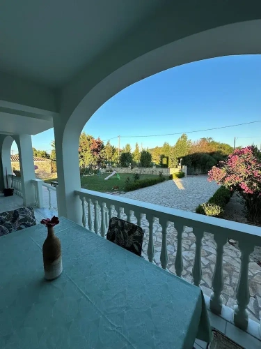 Cottage with balcony and with garden view