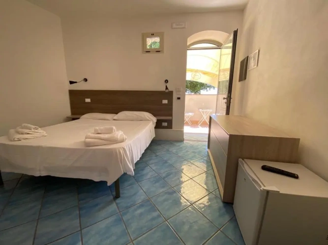 Standard Quadruple room with garden view