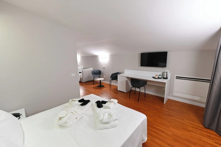 Deluxe Quadruple room with balcony and with courtyard view