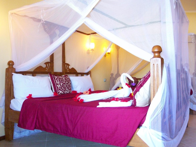 Standard Triple room with garden view