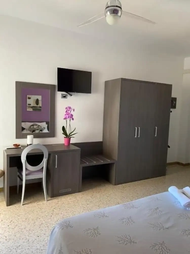 Comfort Quadruple room with balcony and with partial sea view