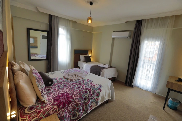 Superior Triple room with balcony and with city view