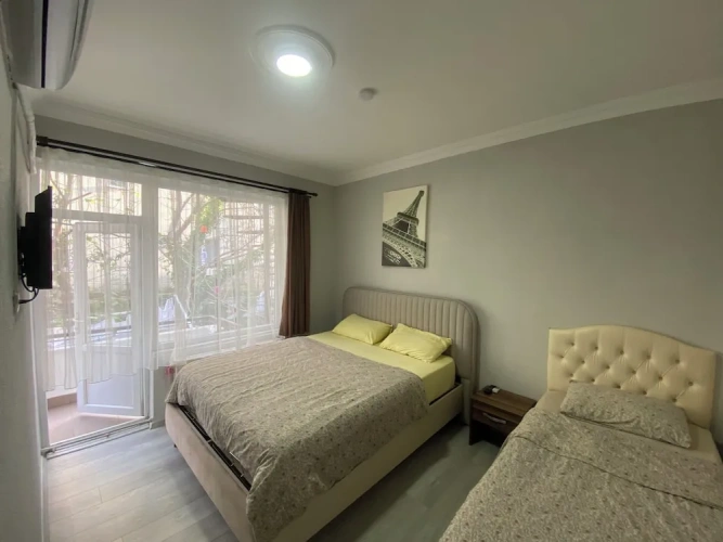 Standard Triple room with balcony and with garden view