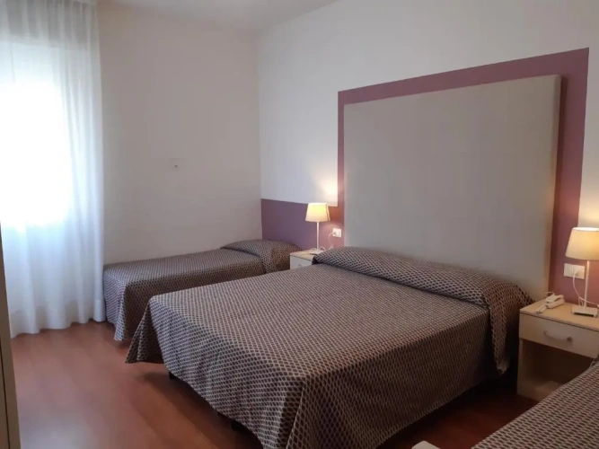 Standard Triple room with balcony and with partial sea view