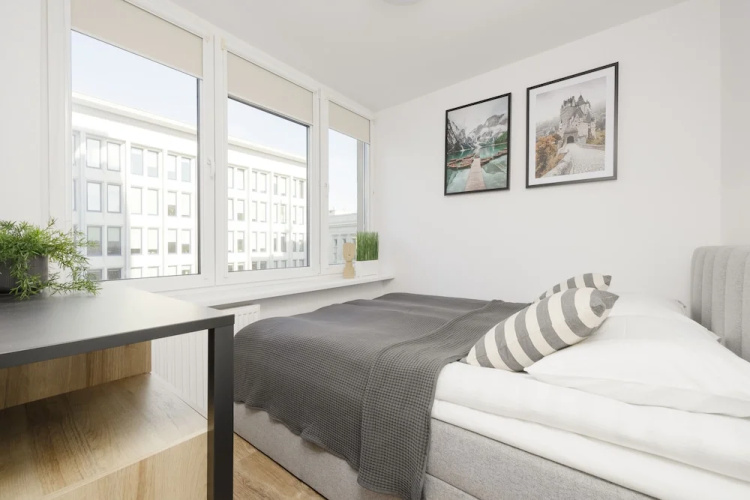 Grey Apartment Śródmieście by Renters