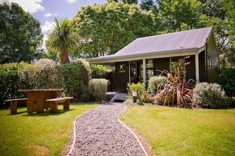 Cottage with balcony and with garden view