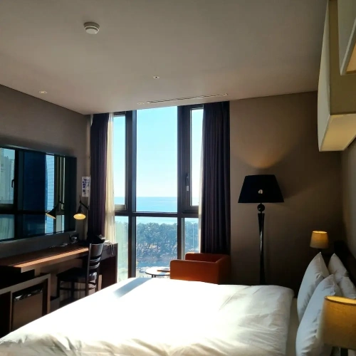 Deluxe Twin Family room with partial ocean view