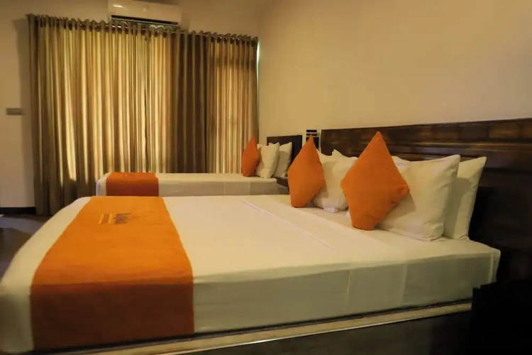 Deluxe Triple room with balcony and with garden view