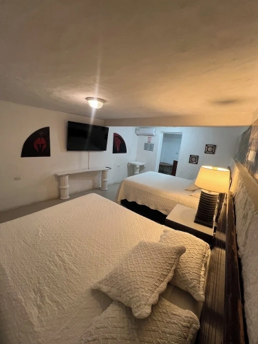 Deluxe Quadruple room with balcony and with garden view