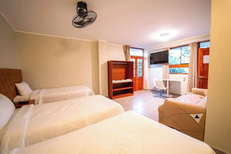 Standard Quadruple room with balcony and with garden view