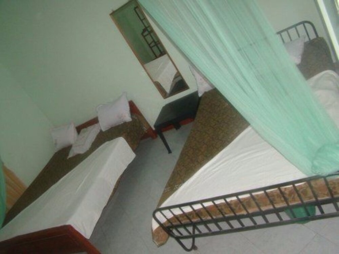 Standard Triple room with garden view