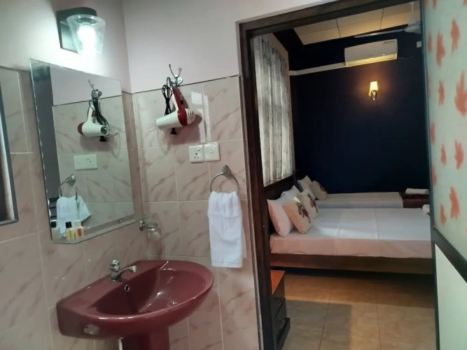 Standard Triple room with balcony and with garden view