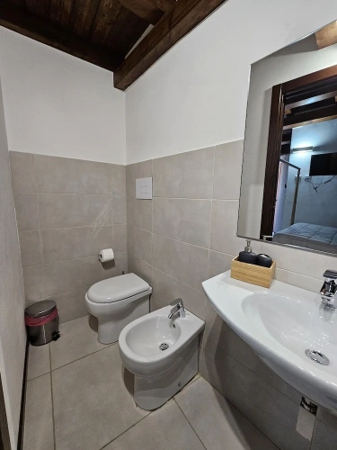 Deluxe Triple room with balcony and with courtyard view
