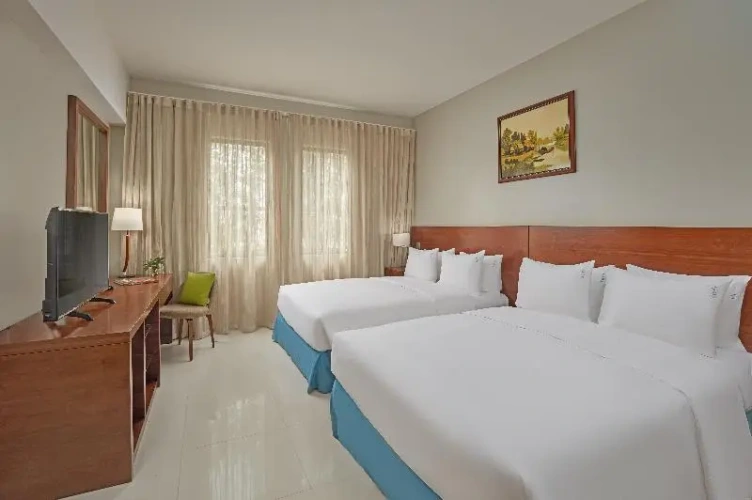 Standard Quadruple room with garden view