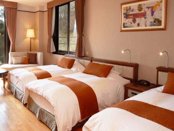 Standard Triple room with garden view