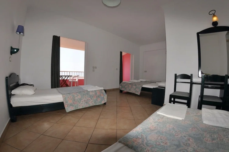 Standard Quadruple room with balcony and with partial sea view