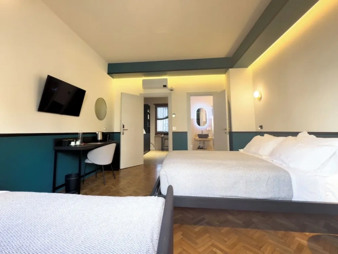 Deluxe Quadruple room with balcony and with city view