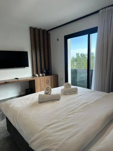 Deluxe Quadruple room with balcony