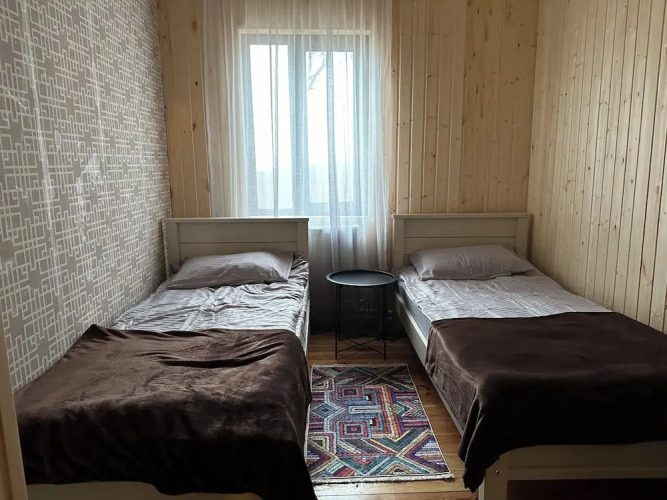 Фотография номера Коттеджа Уютный деревянный дом