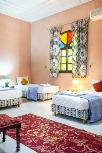Standard Quadruple room with garden view