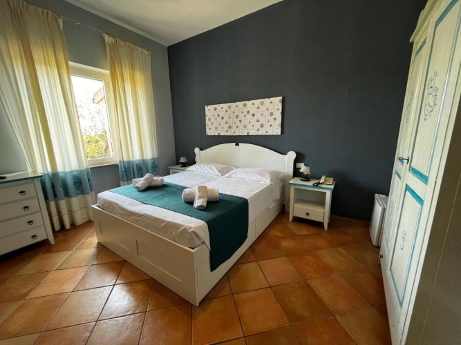 Standard Triple room with garden view