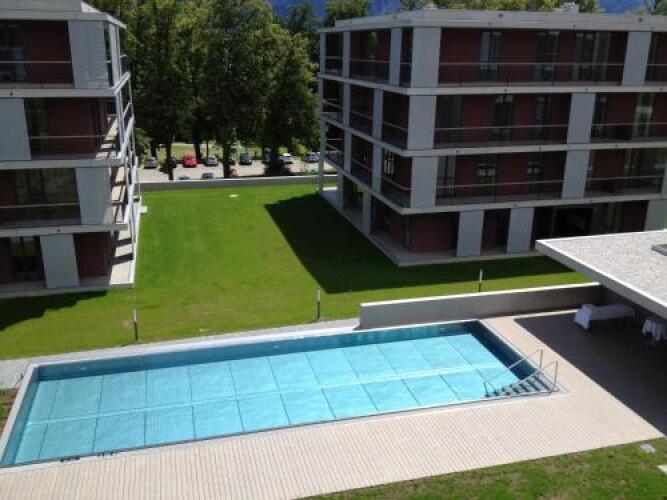 Apartment pool and lakeOver view