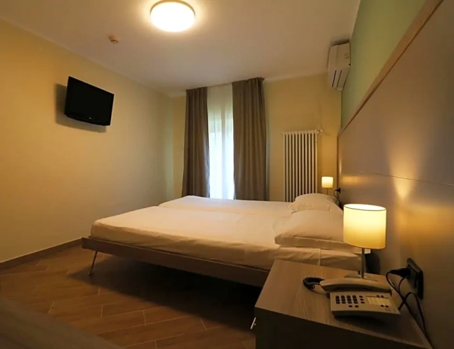 Standard Quadruple room with garden view