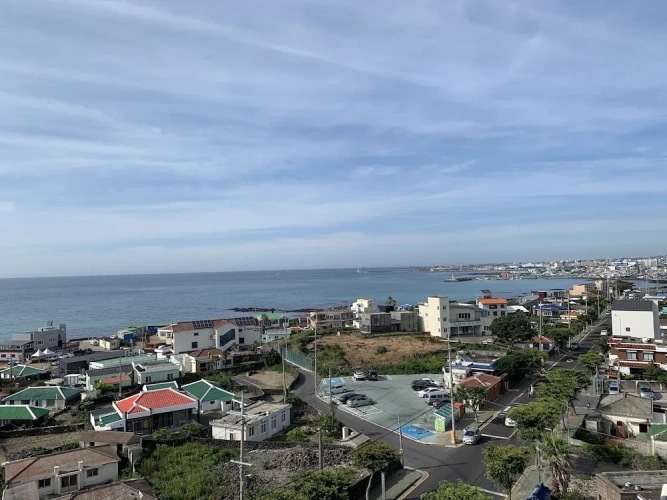 Deluxe Triple room with balcony and beachfront