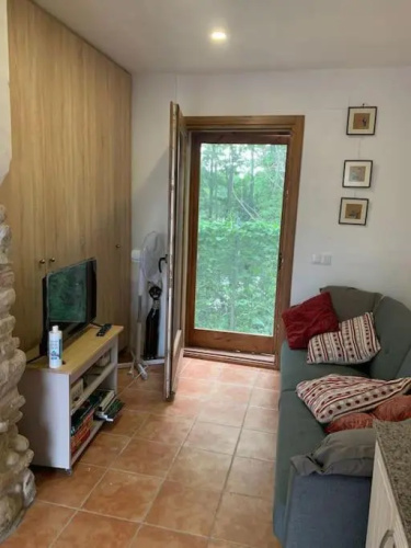 Acogedora casa de invitados con su estilo rustico