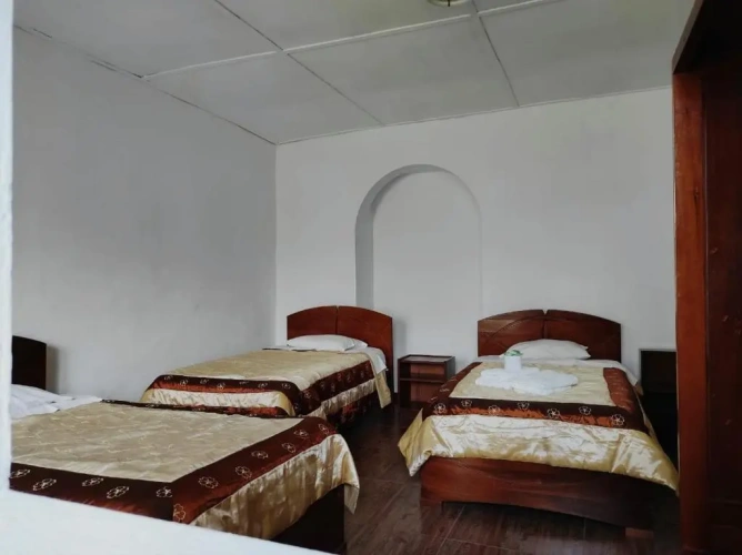Standard Quadruple room with garden view